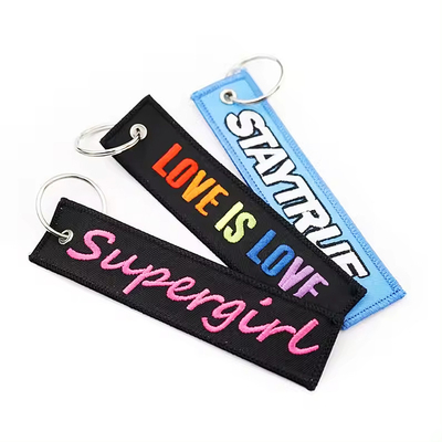 Logo personnalisable clés brodées étiquettes en nylon rayé enlever avant le vol porte-clés