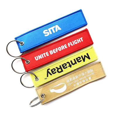Logo personnalisé Cadeaux promotionnels Jet Tag Tissu Broderie Chaînes de voiture Chaînes de clés tissées