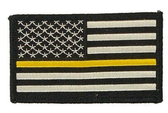 LA LIGNE DE JAUNE DE DRAPEAU DES USA POLICE DE DEGRÉ DE SÉCURITÉ DE DÉPANNEUSE METTENT LE FEU À LA CORRECTION DE BRODERIE